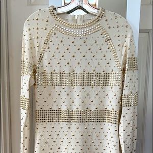 This is a beautiful sleek long sleeve dress. Available to ship immediately.